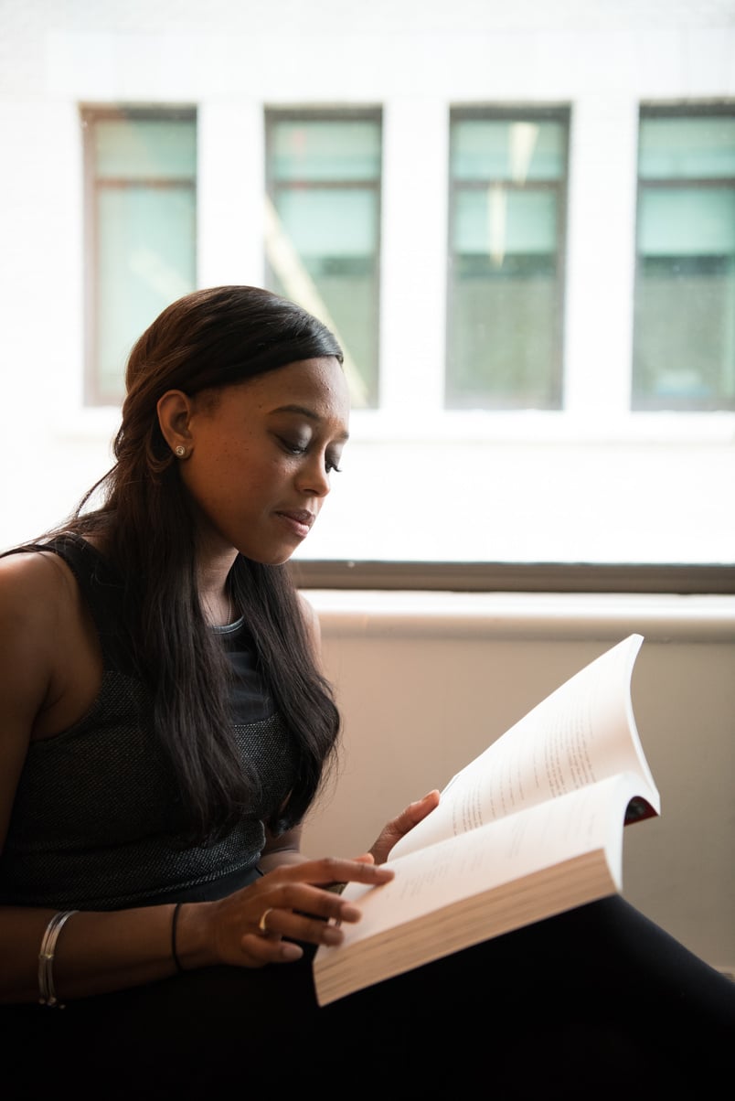 Women in Black Dress Reading Book